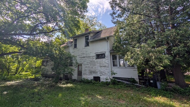 307 10th St S, Wheaton, MN 56296 - view of property exterior featuring a chimney