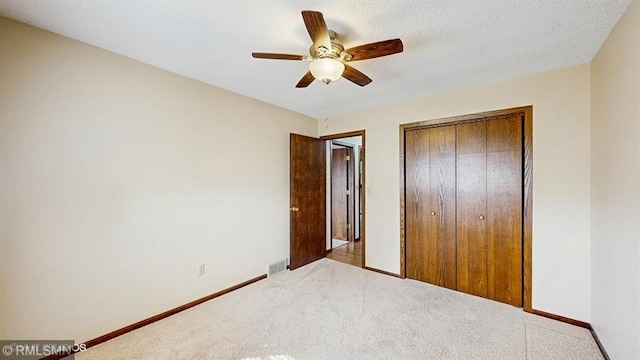 30339 72nd Avenue Way, Cannon Falls, MN 55009 - unfurnished bedroom with carpet flooring, a closet, baseboards, and a ceiling fan