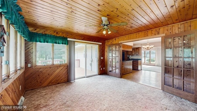 30339 72nd Avenue Way, Cannon Falls, MN 55009 - kitchen with wood walls, a chandelier, light colored carpet, dark countertops, and wood ceiling
