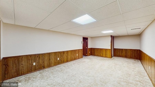 30339 72nd Avenue Way, Cannon Falls, MN 55009 - carpeted empty room with a wainscoted wall, wooden walls, and a paneled ceiling