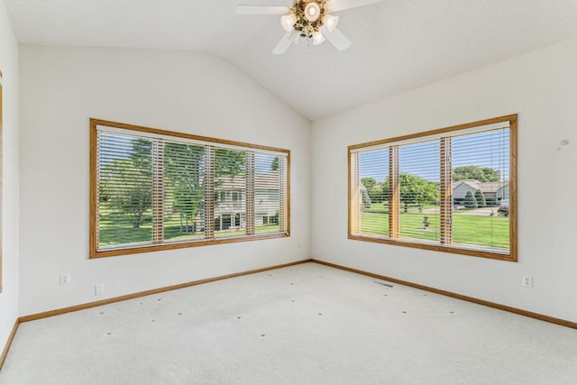 917 133rd Ln NE, Ham Lake, MN 55304 - carpeted empty room featuring vaulted ceiling, baseboards, and ceiling fan
