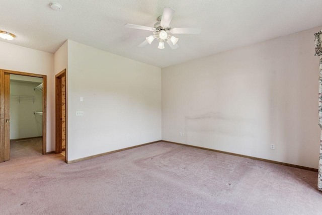 917 133rd Ln NE, Ham Lake, MN 55304 - unfurnished room featuring carpet floors, a smoke detector, ceiling fan, and baseboards