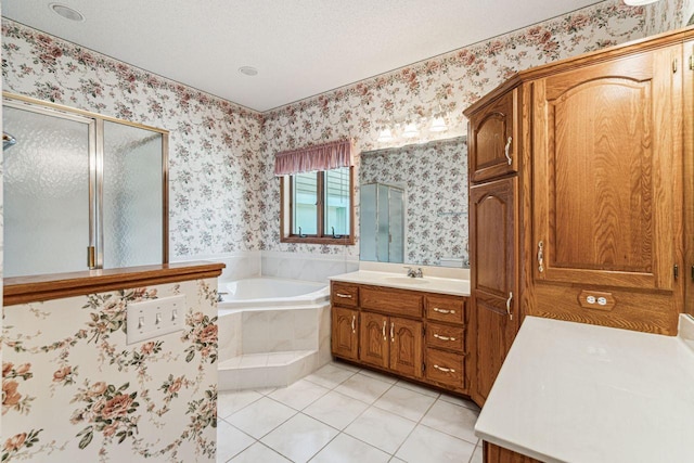 917 133rd Ln NE, Ham Lake, MN 55304 - bathroom with a stall shower, tile patterned floors, vanity, a garden tub, and wallpapered walls
