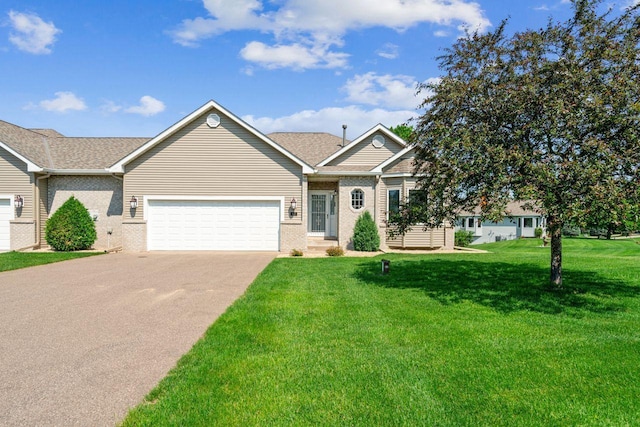 917 133rd Ln NE, Ham Lake, MN 55304 - ranch-style home with brick siding, driveway, a garage, and a front yard