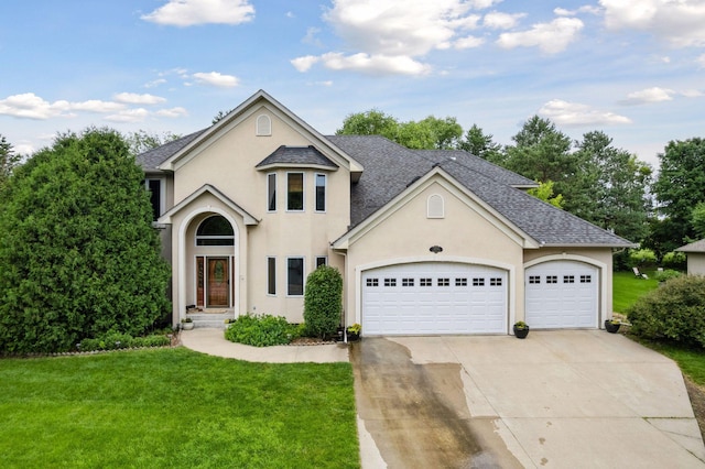 2906 Butternut Dr, Chaska, MN 55318 - traditional home featuring concrete driveway, a front yard, stucco siding, a shingled roof, and an attached garage