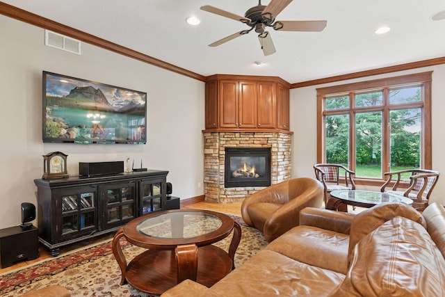 2906 Butternut Dr, Chaska, MN 55318 - living room featuring wood finished floors, crown molding, a fireplace, a ceiling fan, and recessed lighting