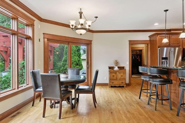 2906 Butternut Dr, Chaska, MN 55318 - dining space featuring a chandelier, crown molding, and light wood-type flooring