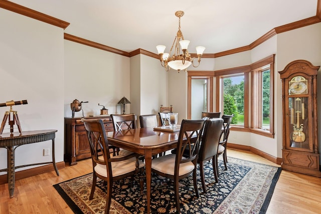 2906 Butternut Dr, Chaska, MN 55318 - dining space featuring a chandelier, crown molding, and light wood finished floors