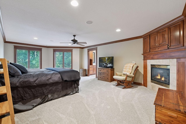 2906 Butternut Dr, Chaska, MN 55318 - bedroom with ornamental molding, a fireplace, light carpet, recessed lighting, and ceiling fan