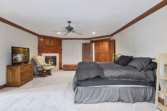 2906 Butternut Dr, Chaska, MN 55318 - bedroom with ornamental molding, light carpet, a glass covered fireplace, recessed lighting, and a ceiling fan