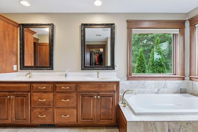 2906 Butternut Dr, Chaska, MN 55318 - full bath featuring double vanity, a bath, and recessed lighting