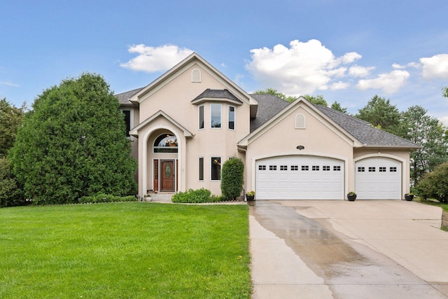 2906 Butternut Dr, Chaska, MN 55318 - view of front of home featuring concrete driveway, a front yard, a garage, and stucco siding