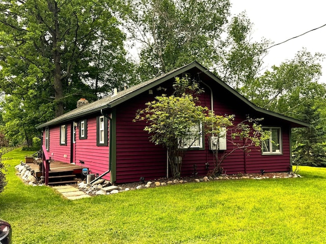 17251 State Highway 6, Deerwood, MN 56444 - view of side of property with a yard, a chimney, and a wooden deck