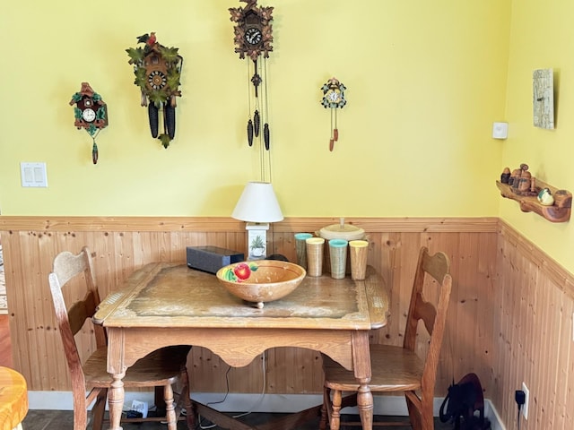 17251 State Highway 6, Deerwood, MN 56444 - dining space with a wainscoted wall and wood walls
