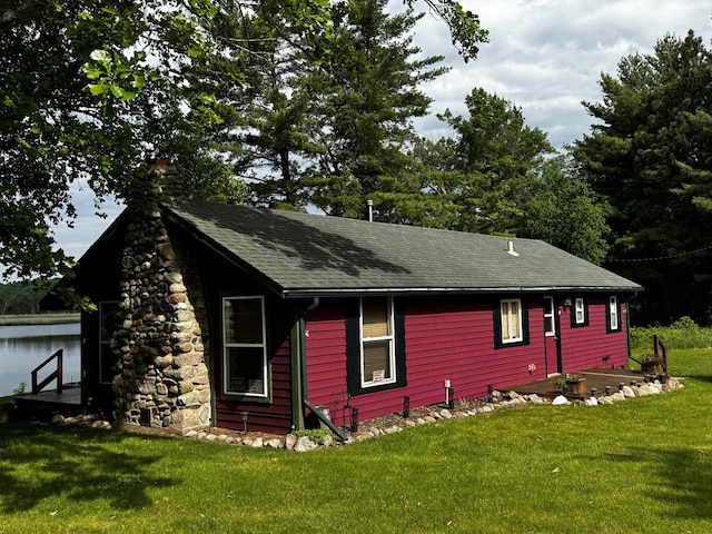 17251 State Highway 6, Deerwood, MN 56444 - view of home's exterior featuring a chimney, a yard, and a shingled roof