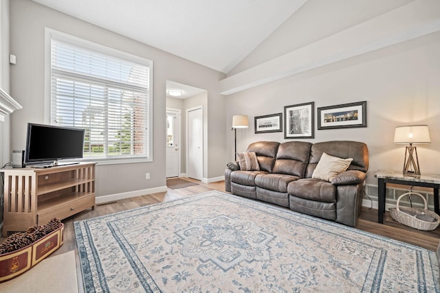 4345 Merrimac Ln N Unit 7, Plymouth, MN 55446 - living area with wood finished floors, lofted ceiling, and baseboards