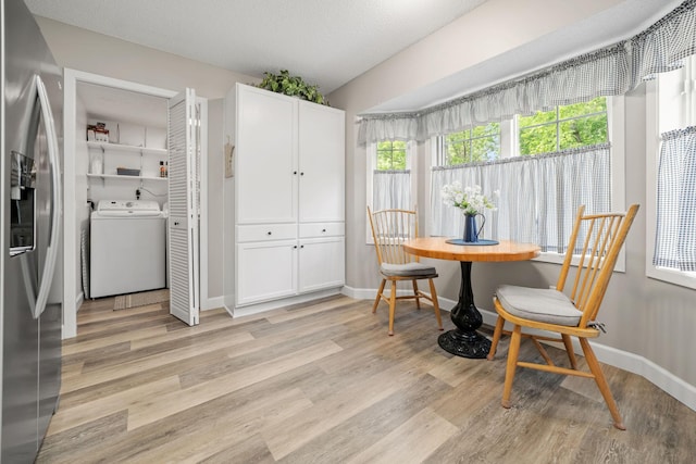 4345 Merrimac Ln N Unit 7, Plymouth, MN 55446 - dining area featuring washer / dryer, light wood-style floors, and baseboards