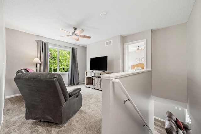 4345 Merrimac Ln N Unit 7, Plymouth, MN 55446 - living area with ceiling fan, baseboards, and light carpet