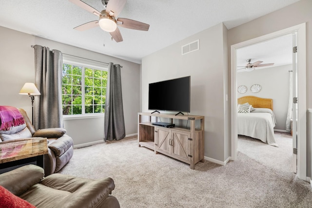 4345 Merrimac Ln N Unit 7, Plymouth, MN 55446 - living area with a ceiling fan, light carpet, and baseboards