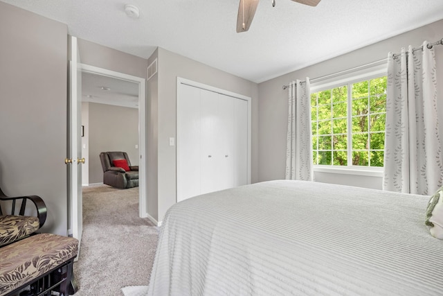 4345 Merrimac Ln N Unit 7, Plymouth, MN 55446 - bedroom featuring carpet flooring, a closet, a ceiling fan, and baseboards