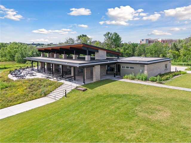 4345 Merrimac Ln N Unit 7, Plymouth, MN 55446 - back of house with a lawn, an attached carport, and a patio
