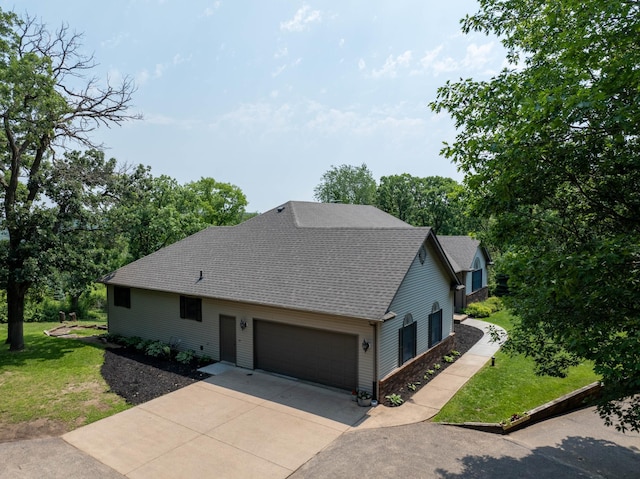 3250 Wild Turkey Ln, Red Wing, MN 55066 - view of front of home with driveway, a front yard, an attached garage, and roof with shingles