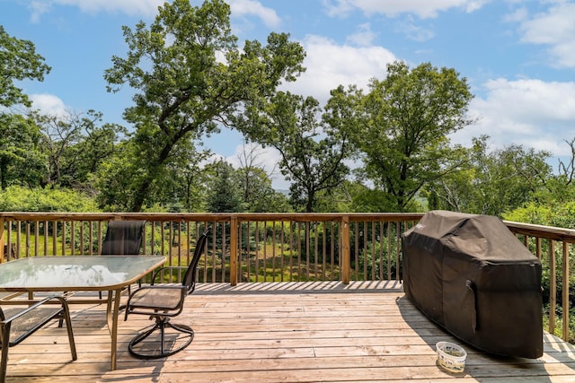 3250 Wild Turkey Ln, Red Wing, MN 55066 - wooden deck featuring outdoor dining space and a grill