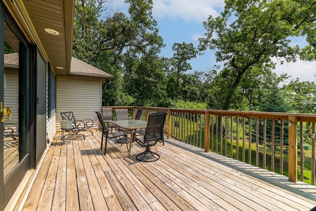 3250 Wild Turkey Ln, Red Wing, MN 55066 - wooden terrace with outdoor dining area and view of wooded area