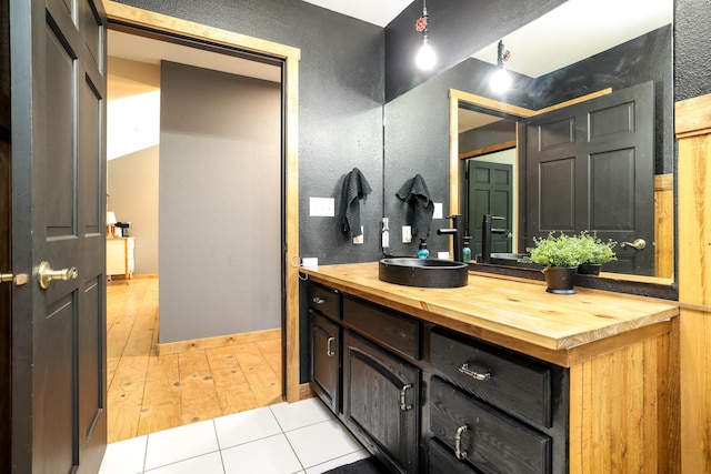 3250 Wild Turkey Ln, Red Wing, MN 55066 - bathroom featuring vanity, a textured wall, and wood finished floors