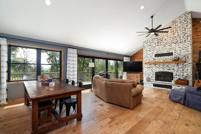 3250 Wild Turkey Ln, Red Wing, MN 55066 - living area featuring high vaulted ceiling, light wood-type flooring, ceiling fan, and a fireplace