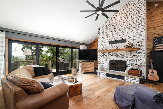 3250 Wild Turkey Ln, Red Wing, MN 55066 - living room featuring high vaulted ceiling, healthy amount of natural light, a ceiling fan, a fireplace, and hardwood / wood-style flooring
