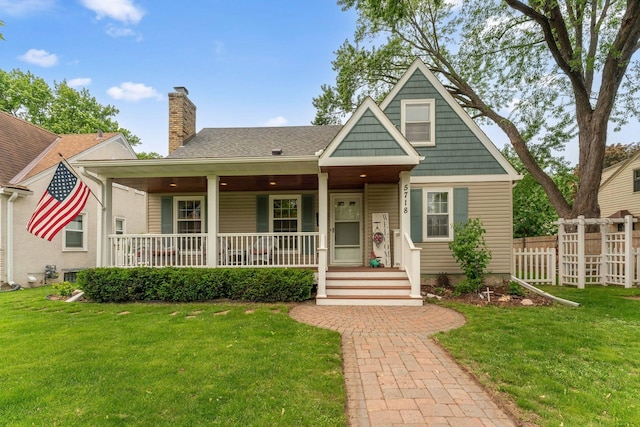 5718 13th Ave S, Minneapolis, MN 55417 - bungalow-style home with covered porch, a chimney, and a shingled roof