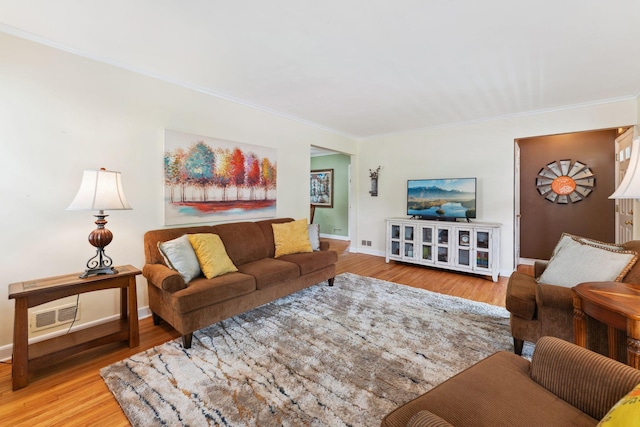 5718 13th Ave S, Minneapolis, MN 55417 - living area featuring crown molding, wood finished floors, and baseboards