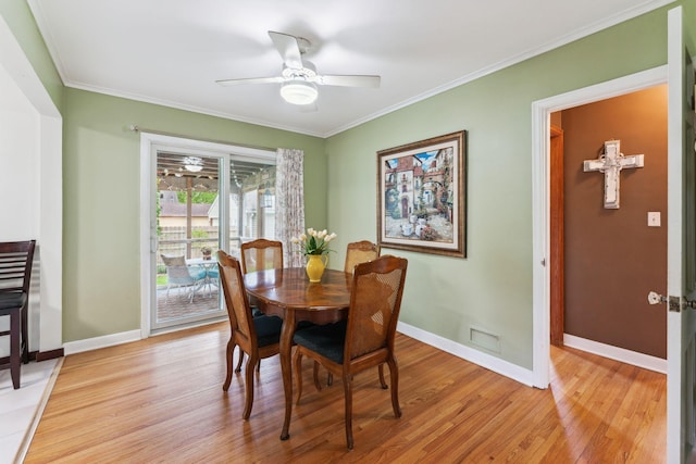 5718 13th Ave S, Minneapolis, MN 55417 - dining room featuring light wood-style flooring, ornamental molding, baseboards, and a ceiling fan