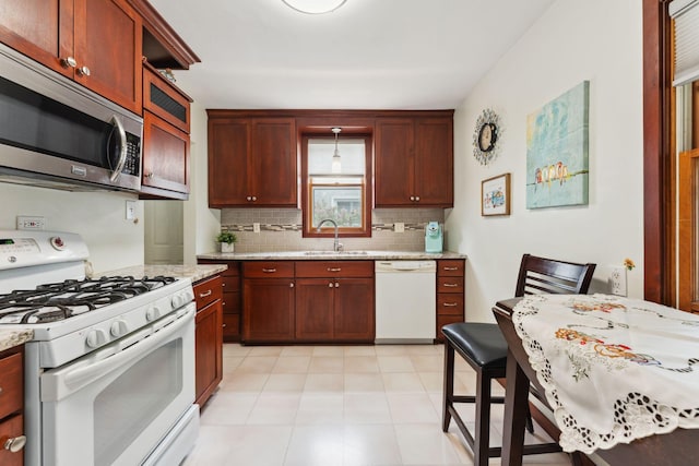 5718 13th Ave S, Minneapolis, MN 55417 - kitchen with white appliances, a sink, decorative backsplash, light stone counters, and dark brown cabinets
