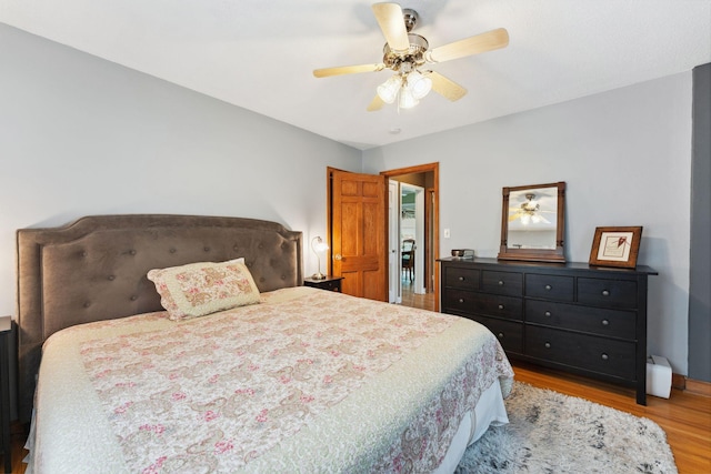 5718 13th Ave S, Minneapolis, MN 55417 - bedroom featuring light wood-style flooring and ceiling fan