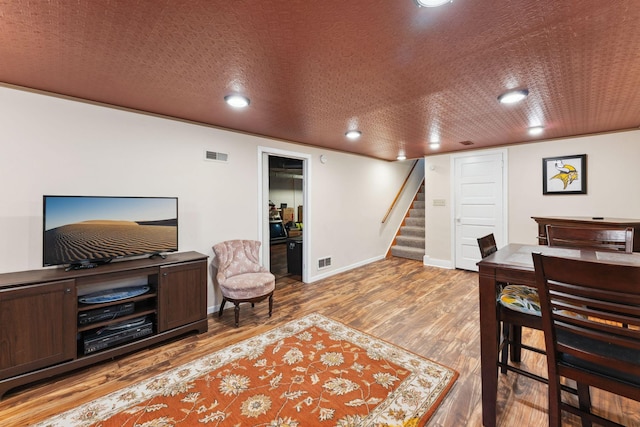 5718 13th Ave S, Minneapolis, MN 55417 - living room with wood finished floors, stairway, baseboards, and recessed lighting