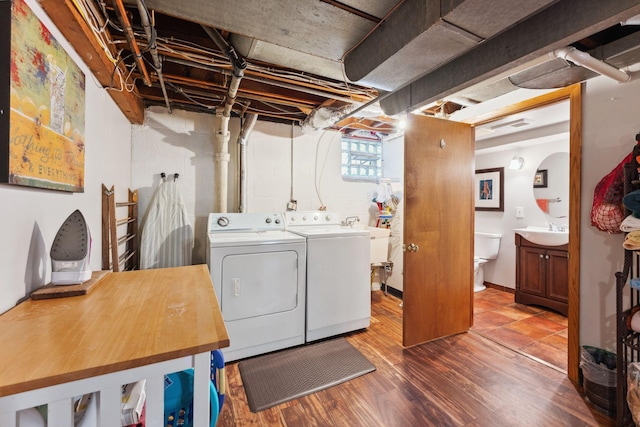 5718 13th Ave S, Minneapolis, MN 55417 - laundry room with washing machine and clothes dryer and wood finished floors