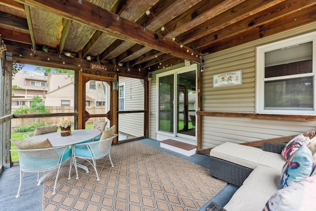 5718 13th Ave S, Minneapolis, MN 55417 - sunroom with outdoor dining area and beamed ceiling