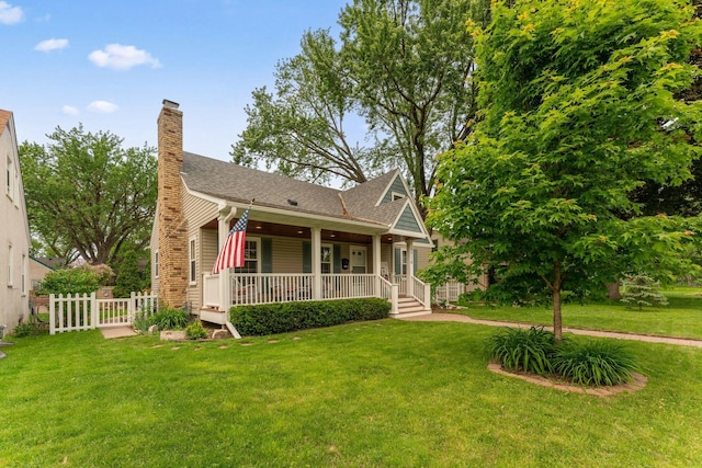 5718 13th Ave S, Minneapolis, MN 55417 - view of front of property featuring covered porch, a chimney, and a shingled roof