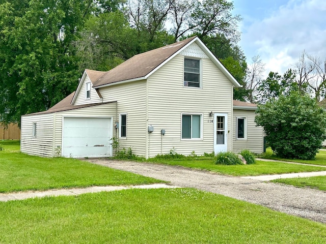 114 Thompson Ave, Rushmore, MN 56168 - traditional-style home featuring driveway, a garage, a front lawn, and a shingled roof