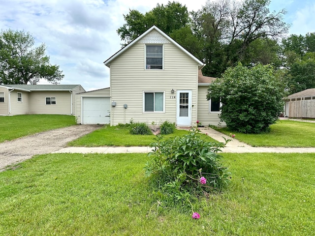 114 Thompson Ave, Rushmore, MN 56168 - traditional-style home featuring driveway, a front lawn, and a garage