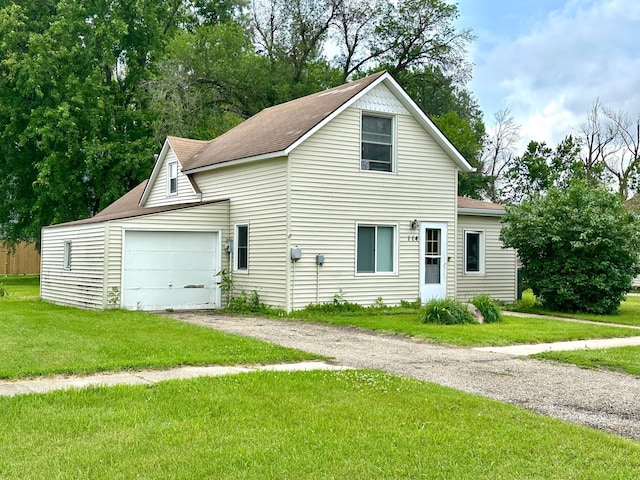 114 Thompson Ave, Rushmore, MN 56168 - traditional-style house featuring driveway, a garage, a front yard, and a shingled roof