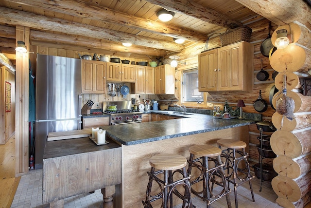 9453 Little Elbow Lk N, Cook, MN 55723 - kitchen featuring appliances with stainless steel finishes, wood ceiling with exposed beams, dark countertops, a peninsula, and a kitchen bar