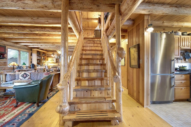 9453 Little Elbow Lk N, Cook, MN 55723 - stairs with hardwood / wood-style floors, wood ceiling with exposed beams, and log walls