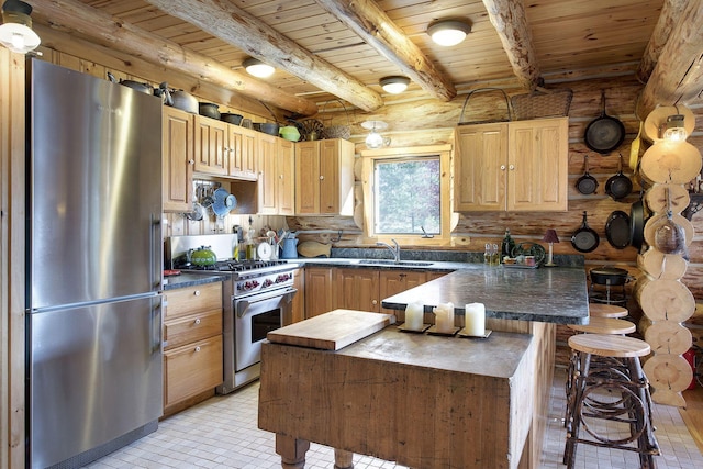 9453 Little Elbow Lk N, Cook, MN 55723 - kitchen featuring appliances with stainless steel finishes, a sink, wooden ceiling with exposed beams, dark countertops, and a peninsula