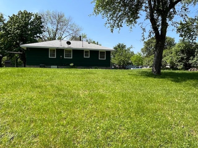 757 111th Ave NW, Coon Rapids, MN 55448 - rear view of property featuring a lawn