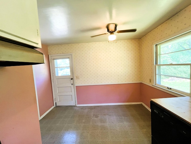 757 111th Ave NW, Coon Rapids, MN 55448 - unfurnished dining area with baseboards, wallpapered walls, and a ceiling fan