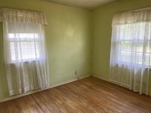 757 111th Ave NW, Coon Rapids, MN 55448 - spare room with wood finished floors and baseboards