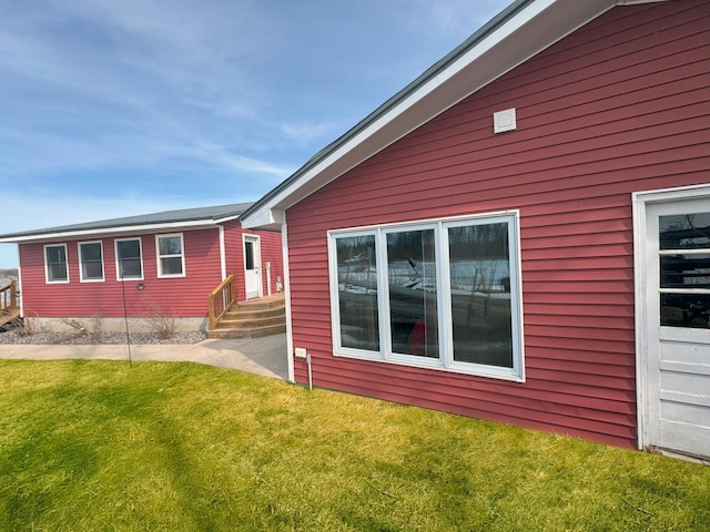 13150 Maple Circle Dr SE, Hudson Twp, MN 56334 - view of home's exterior featuring a lawn